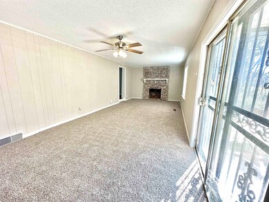 Unfurnished living room featuring carpet, a ceilin