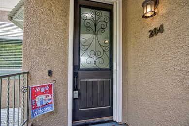 Doorway to property with stucco siding