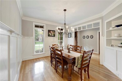 Dining room with wainscoting and built-in shelving