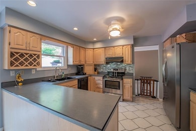 Kitchen features stainless steel appliances, lots 