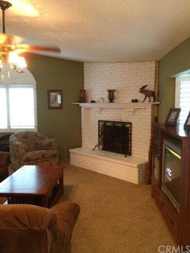 Living Room with Fireplace and Custom Shutters