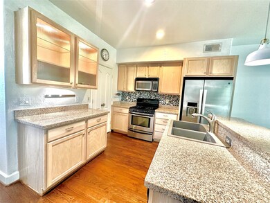 Kitchen has lots of storage and counter space with