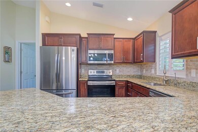 Kitchen featuring sink, appliances with stainless 