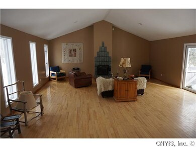 Living Room. Pellet stove stays with house. Slidin