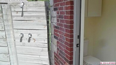 Garage has half bath and outdoor shower for pool