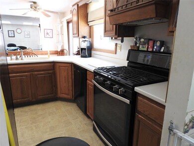 Kitchen with newer gas stove/oven.