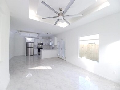 Unfurnished living room with a ceiling fan and marble finish floor