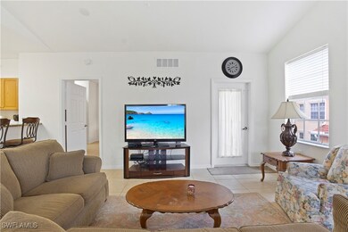 Living area featuring light tile patterned floorin