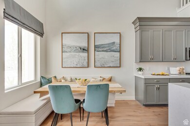 PHOTO FROM SIMILAR MODEL HOME. COLORS, OPTIONS, AND FEATURES WILL VARY: Dining area with breakfast area, plenty of natural light, and light wood-type flooring
