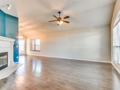 Unfurnished living room featuring dark wood-type f