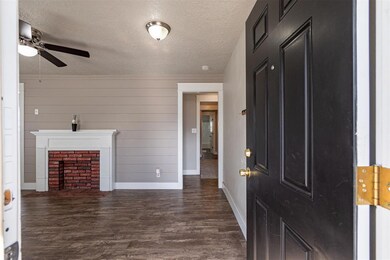 Entryway with dark hardwood / wood-style flooring,