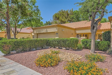 Mediterranean / spanish house featuring a tile roo