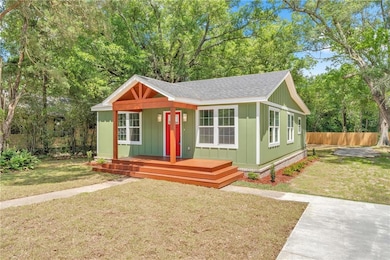 Bungalow featuring roof with shingles and board an