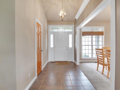 Tile entry with easy access to coat closet.