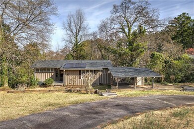 View of front of house with solar panels, an attac