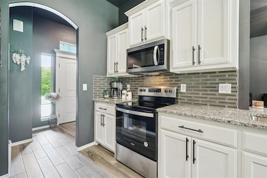 Kitchen featuring appliances with stainless steel 