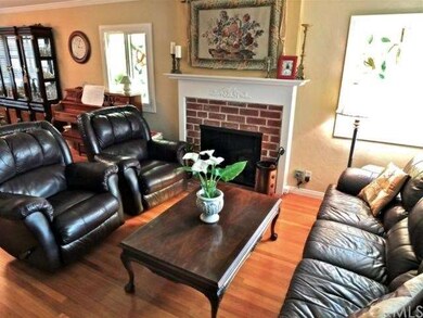 Sunny living room with fireplace and mantle