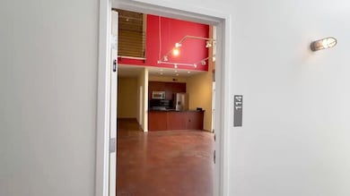Hall featuring finished concrete flooring