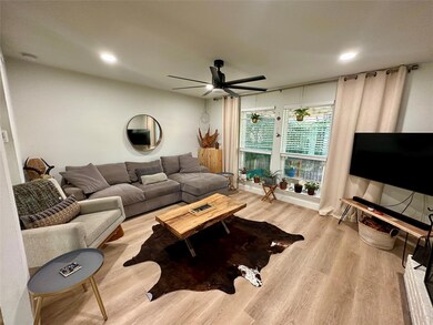 Living room with recessed lighting, a ceiling fan