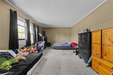 Sitting room of the home. Can also be used as a den/living space.