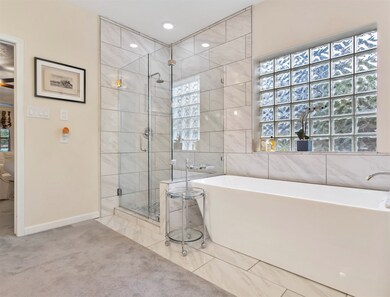 Frameless shower included a traditional shower hea