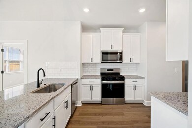 Highly functional, this kitchen maximizes space with smart storage and layout!