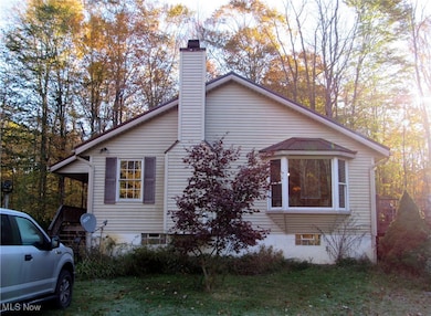 View of property exterior featuring a chimney