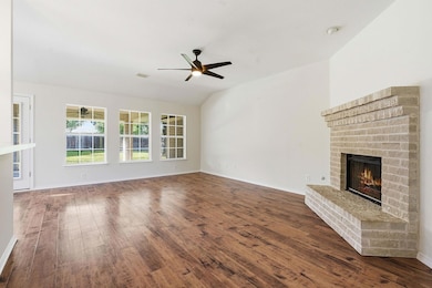 Unfurnished living room with dark wood finished f