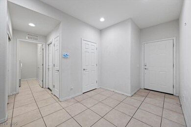 Entryway with light tile patterned floors, recesse