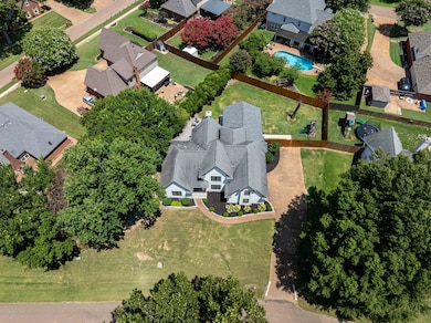 Aerial view of residential area featuring a pool