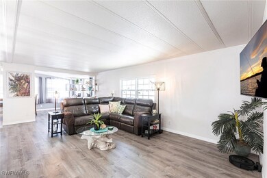 Living room with hardwood / wood-style flooring, p