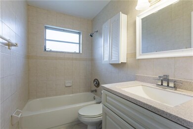 Updated bathroom with combination shower/tub