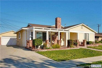 Long Cement Driveway with a gated  entry to the ba