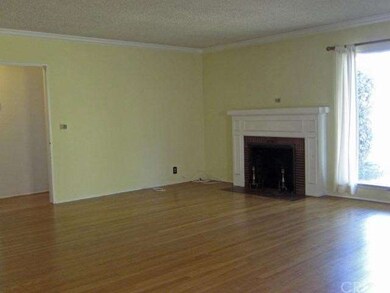 Living room with beautiful hardwood floors and fir