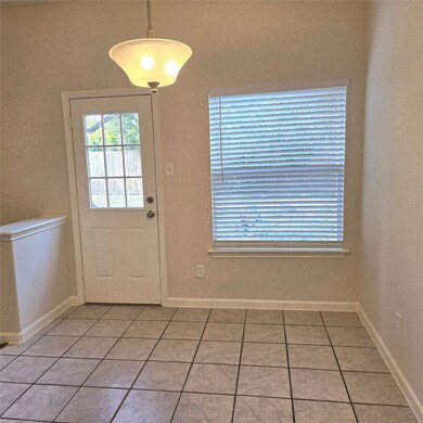 Bright breakfast area with tiled flooring, featuri