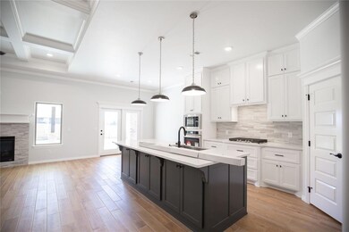 Kitchen featuring decorative light fixtures, a kit