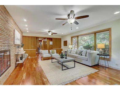 Spacious living room boasts cherry hardwood floors