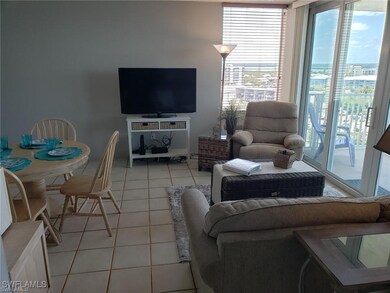 Living area with light tile patterned floors and plenty of natural light