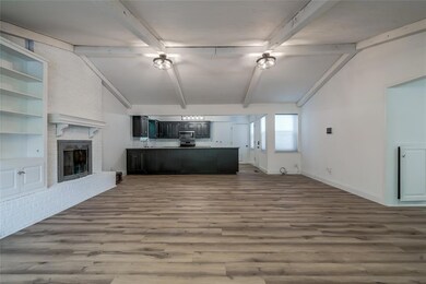 Unfurnished living room with built in features, a 