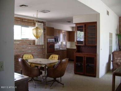 Dining area off kitchen with a hutch