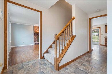 Spacious entry that opens to living and family roo