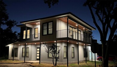 Property exterior at twilight with a balcony and 