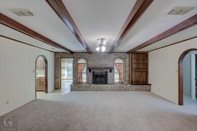 Family/ Living room featuring visible vents, brick