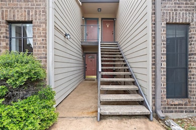 Doorway to property with brick siding