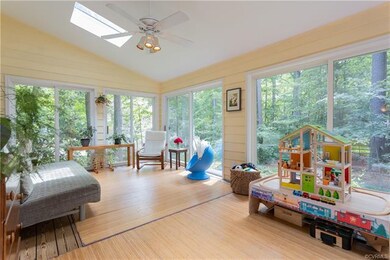 Four season sunroom with new skylights makes a great flex-space. Look how private your view is!
