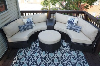 End unit offering beautiful back deck and views.