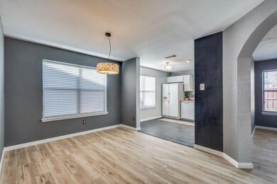 Empty room with light hardwood / wood-style floori