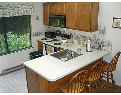 Kitchen. Vaulted ceiling with 2 skylights