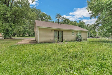 Rear view of property with french doors