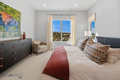 Primary bedroom with golf course and mountain view